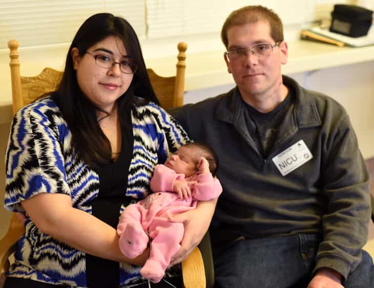 New parents with newborn baby