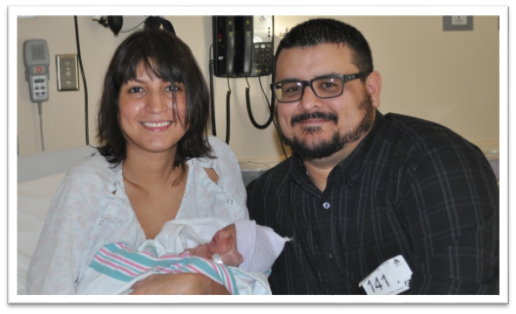 John and Lucia Gomez holding new baby boy